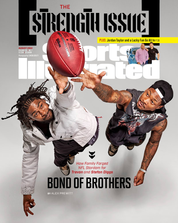 Trevon and Stefon Diggs leap for a football on the cover of the Sports Illustrated August 2022 issue